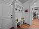 Bright mudroom area featuring a bench, cubbies, and hooks, perfect for organization at 3587 Garner Terrace Way, Wake Forest, NC 27587