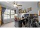 Bright home office with built-in desk, dual monitors, and a large window view at 3587 Garner Terrace Way, Wake Forest, NC 27587