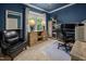 Cozy home office showcasing custom wood accents, a large window, and ample desk space at 3587 Garner Terrace Way, Wake Forest, NC 27587