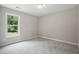 Shows the bedroom with carpeted floors and a window at 39 Blue Heron Ct, Kenly, NC 27542