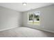 Shows the bedroom with carpeted floors and a window view at 39 Blue Heron Ct, Kenly, NC 27542