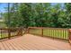 Wood deck overlooking a green lawn and wooded area at 39 Blue Heron Ct, Kenly, NC 27542