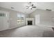Cozy living room featuring a fireplace and a seamless entryway; bathed in natural light and neutral tones at 39 Blue Heron Ct, Kenly, NC 27542