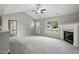 Spacious living room featuring a fireplace and seamless entry with an outside view from the window at 39 Blue Heron Ct, Kenly, NC 27542