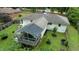 An aerial view of the backyard with its spacious deck, screened in porch, and mature trees, providing a serene retreat at 3934 Hope Valley Rd, Durham, NC 27707