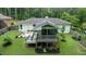 The spacious backyard features a screened in porch and a wooden deck perfect for outdoor enjoyment and entertainment at 3934 Hope Valley Rd, Durham, NC 27707