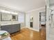 Open bathroom featuring standalone tub, dual vanity, shower, and hardwood floors at 3934 Hope Valley Rd, Durham, NC 27707