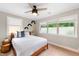 Bedroom with a ceiling fan, carpet, and windows with privacy film at 3934 Hope Valley Rd, Durham, NC 27707