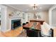 Dining room featuring a unique table, fireplace, and stylish decor at 3934 Hope Valley Rd, Durham, NC 27707