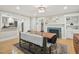 Spacious dining area with view to kitchen, fireplace, and modern lighting at 3934 Hope Valley Rd, Durham, NC 27707