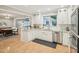 Well-lit kitchen featuring stainless steel appliances and granite countertops at 3934 Hope Valley Rd, Durham, NC 27707