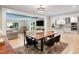Open-concept living and dining area with bright kitchen at 3934 Hope Valley Rd, Durham, NC 27707