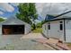 View of the backyard with detached garage and separate building at 408 N Maple St, Graham, NC 27253