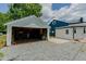 Detached garage and house combination with ample parking space at 408 N Maple St, Graham, NC 27253