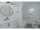 Bathroom featuring a shower/tub, a toilet, and a sink with vanity at 408 N Maple St, Graham, NC 27253