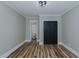 Bedroom with closet, wood flooring, and access to an attached bathroom at 408 N Maple St, Graham, NC 27253
