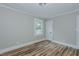 Bedroom featuring wood flooring and window at 408 N Maple St, Graham, NC 27253