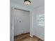 Bedroom closet with wood flooring and bifold door at 408 N Maple St, Graham, NC 27253