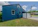 Rear view of the house with its vibrant exterior and a glimpse of the backyard at 408 N Maple St, Graham, NC 27253