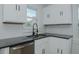 Kitchen area featuring new stainless steel dishwasher and stone countertops at 408 N Maple St, Graham, NC 27253