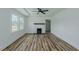 Elegant living room boasts a fireplace, ceiling fan, and large window at 408 N Maple St, Graham, NC 27253