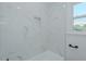 Modern tiled shower and niche in updated bathroom at 408 N Maple St, Graham, NC 27253