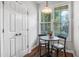 Charming breakfast nook featuring a dark wood table, two chairs, and bright window views at 412 Heritage Village Ln, Apex, NC 27502