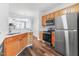 Modern kitchen with stainless steel appliances, wood cabinets, and an open layout at 412 Heritage Village Ln, Apex, NC 27502