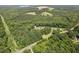 Scenic aerial view of this home surrounded by a beautiful wooded and countryside setting at 4403 Jeffries Rd, Durham, NC 27704