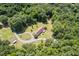 Aerial shot showcasing the house on a vast property, framed by the beauty of surrounding trees at 4403 Jeffries Rd, Durham, NC 27704