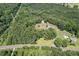 Scenic aerial view of this home in a beautiful wooded and countryside setting at 4403 Jeffries Rd, Durham, NC 27704