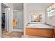 Bathroom featuring a soaking tub, shower, and walk-in closet at 4403 Jeffries Rd, Durham, NC 27704