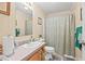 Bathroom featuring a single sink, mirror, and shower with curtain at 4403 Jeffries Rd, Durham, NC 27704