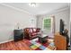Cozy bedroom featuring a colorful area rug, window, and comfortable seating at 4403 Jeffries Rd, Durham, NC 27704