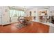 Cozy dining area with hardwood floors, an inviting table set for six, and natural light, adjacent to the kitchen at 4403 Jeffries Rd, Durham, NC 27704