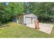 Spacious two-car garage with ample storage space and a concrete pad at 4403 Jeffries Rd, Durham, NC 27704