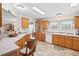 Bright eat-in kitchen with wooden cabinets, ample counter space, and lots of natural light at 4403 Jeffries Rd, Durham, NC 27704