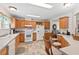 Bright kitchen with wooden cabinets, ample counter space, and view to living room at 4403 Jeffries Rd, Durham, NC 27704