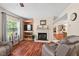 Living room features a fireplace, built-in shelving, and view to the kitchen and dining room at 4403 Jeffries Rd, Durham, NC 27704