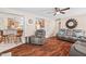 Inviting living room featuring hardwood floors, comfortable seating, and seamless flow to the kitchen at 4403 Jeffries Rd, Durham, NC 27704