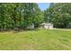 The property includes outbuildings, mature trees and landscaping, adding to the appeal of the property at 4403 Jeffries Rd, Durham, NC 27704