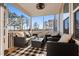 Relaxing screened-in porch with stylish furniture and a view of the trees at 46 Two Belles Ct, Angier, NC 27501