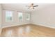Large bedroom with multiple windows and wood floors, offering ample natural light at 503 Gateway Townes Blvd, Wake Forest, NC 27587