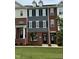 Traditional brick townhome featuring black shutters and manicured lawn at 503 Gateway Townes Blvd, Wake Forest, NC 27587