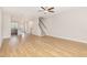 Spacious living room features wood-look floors and a staircase, offering an open view of the kitchen at 503 Gateway Townes Blvd, Wake Forest, NC 27587