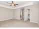 Main bedroom featuring plush carpet, tray ceiling, and doorway to bath and closet at 503 Gateway Townes Blvd, Wake Forest, NC 27587
