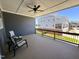 Covered patio featuring a ceiling fan and chairs at 503 Gateway Townes Blvd, Wake Forest, NC 27587