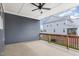 Covered patio area perfect for outdoor relaxation, featuring a ceiling fan and railing at 503 Gateway Townes Blvd, Wake Forest, NC 27587