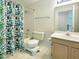 Neutral bathroom featuring a tub with shower and a vanity with a framed mirror at 5105 Carolwood Ln, Durham, NC 27713