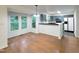 View of the dining area with hardwood floors that has lots of natural light with an adjacent kitchen at 5105 Carolwood Ln, Durham, NC 27713